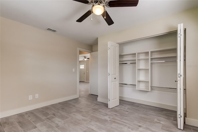 unfurnished bedroom featuring ceiling fan, a closet, and light hardwood / wood-style floors