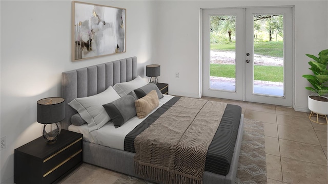 bedroom with access to exterior and light tile patterned floors