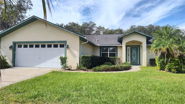 ranch-style home with a garage and a front yard