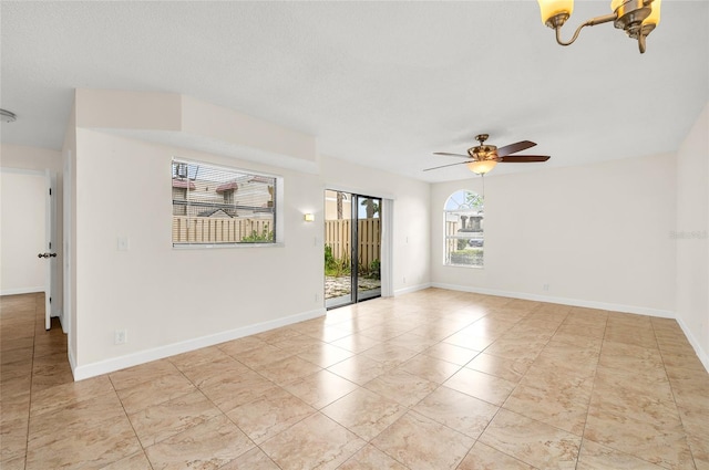 unfurnished room with a textured ceiling and ceiling fan