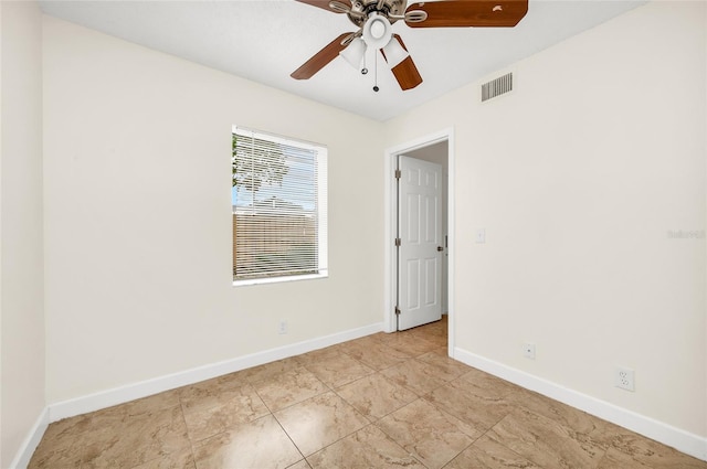 empty room featuring ceiling fan