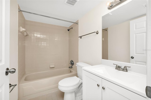 full bathroom with tile patterned flooring, vanity, toilet, and tiled shower / bath