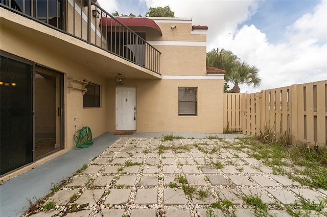 exterior space with a patio area and a balcony