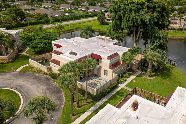 drone / aerial view with a water view and a residential view