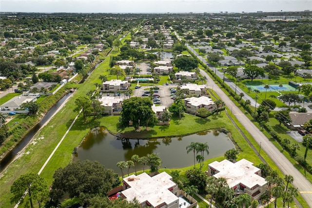 birds eye view of property with a water view and a residential view