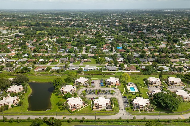 bird's eye view featuring a residential view and a water view