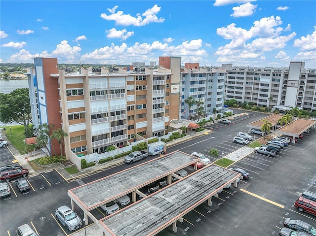 500 Treasure Island Cswy Unit 406, Treasure Island, FL 33706 - view of property with uncovered parking and a water view