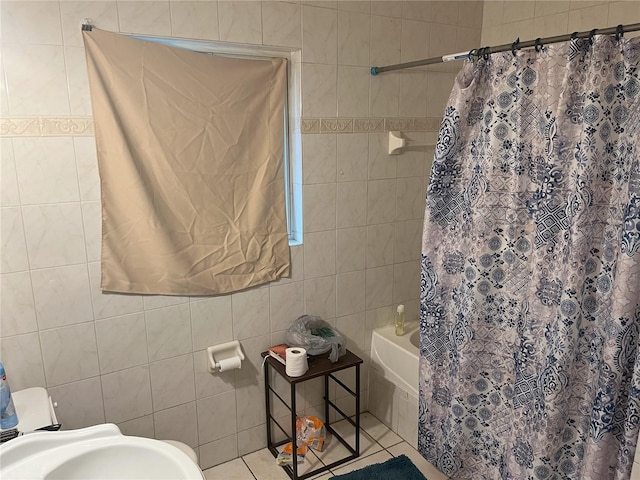 bathroom featuring tile walls, tile patterned flooring, toilet, and shower / tub combo with curtain