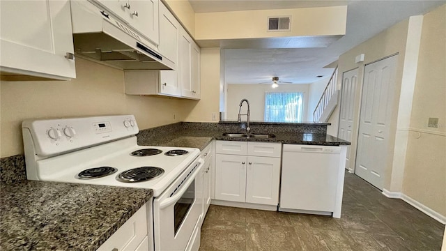 kitchen featuring visible vents, a peninsula, white appliances, white cabinetry, and a sink