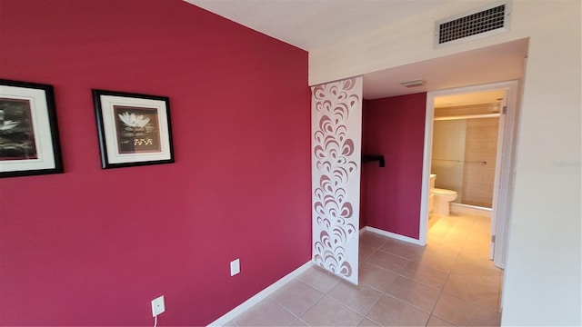 corridor with light tile patterned floors