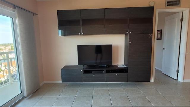 living room with light tile patterned flooring