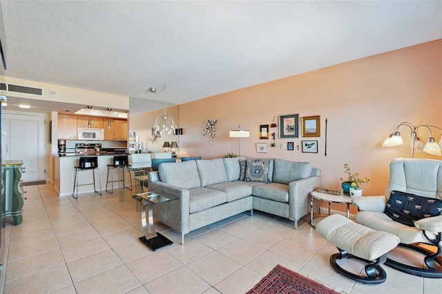 tiled living room with a textured ceiling