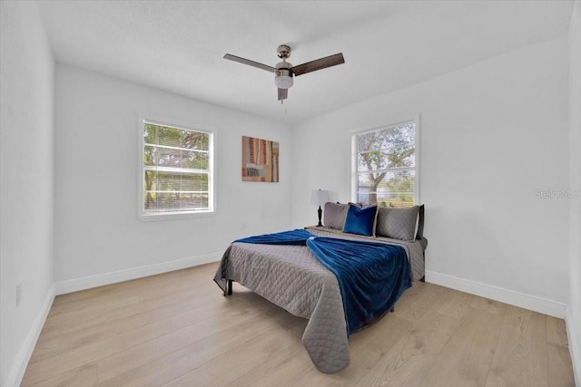 bedroom featuring light hardwood / wood-style flooring and ceiling fan