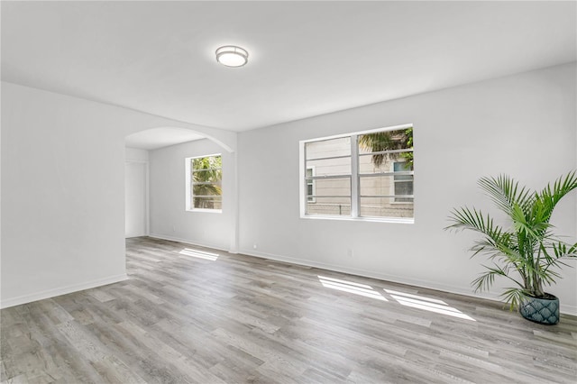 spare room with light hardwood / wood-style floors