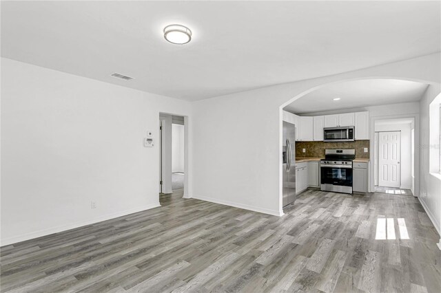 unfurnished living room featuring light wood-type flooring