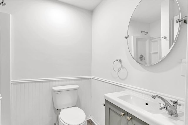 bathroom featuring toilet and vanity