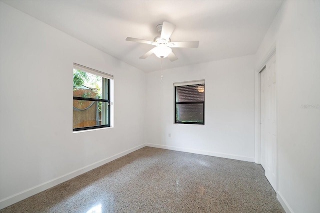 unfurnished room with ceiling fan