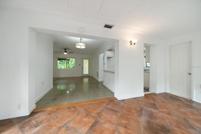 spare room featuring ceiling fan