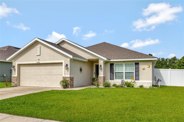 view of front of house featuring an attached garage, fence, driveway, stucco siding, and a front yard