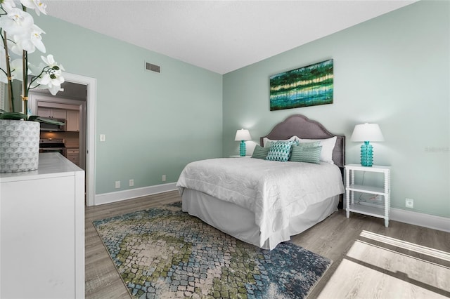 bedroom featuring hardwood / wood-style floors