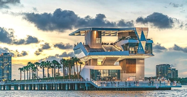 outdoor building at dusk featuring a water view