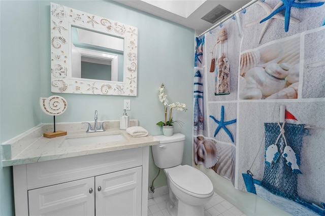 full bathroom with tile patterned floors, vanity, toilet, and shower / bath combo