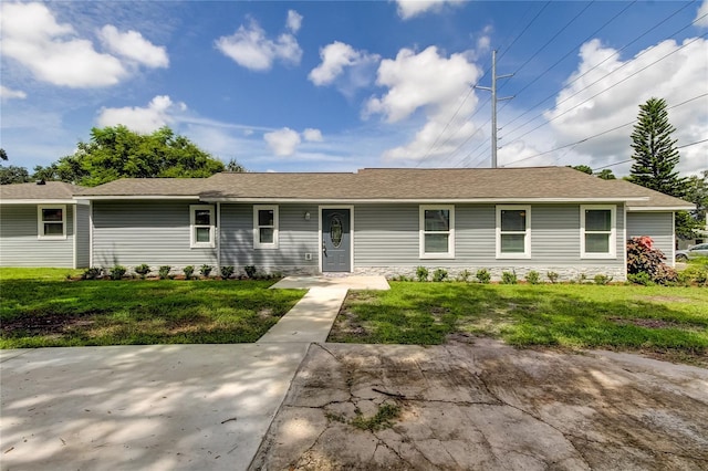 single story home featuring a front lawn