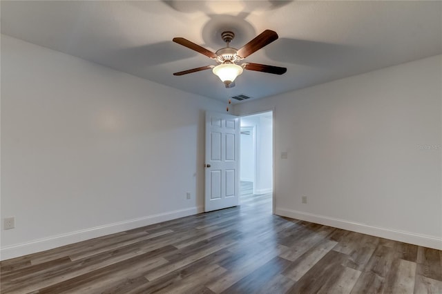 empty room featuring hardwood / wood-style flooring and ceiling fan