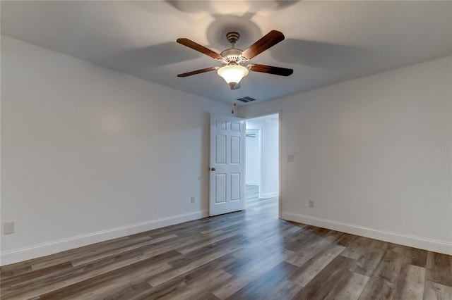 911 8th Ave SW, Largo, FL 33770 - unfurnished room featuring ceiling fan, baseboards, wood finished floors, and visible vents