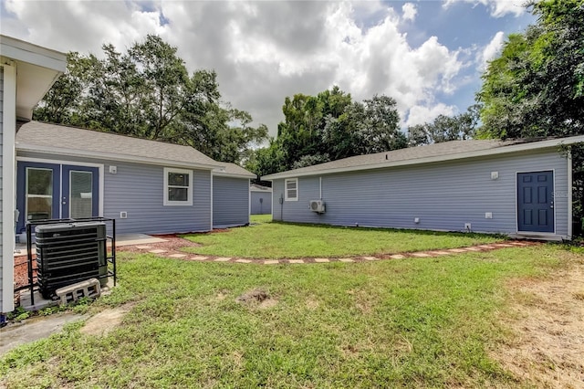 911 8th Ave SW, Largo, FL 33770 - view of yard featuring central AC unit