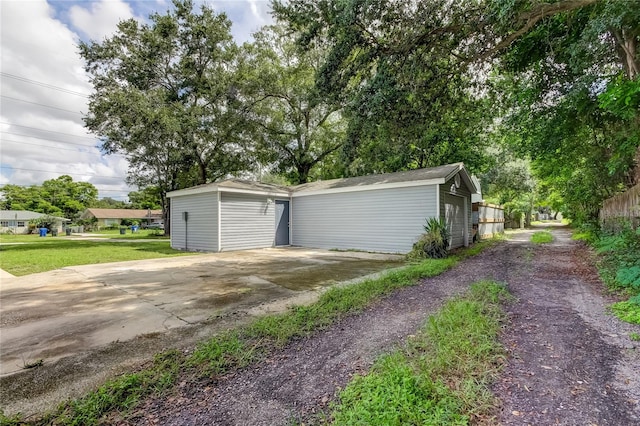 garage featuring a lawn