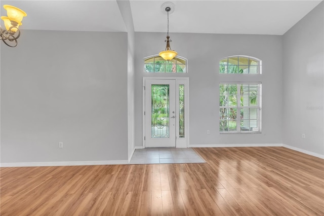 foyer entrance with light hardwood / wood-style floors