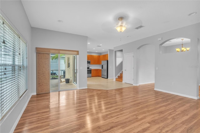 unfurnished living room featuring light wood-type flooring