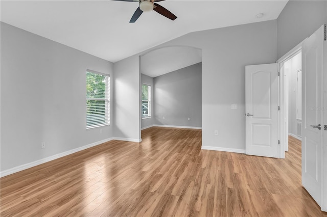 interior space with light wood-type flooring, ceiling fan, and vaulted ceiling