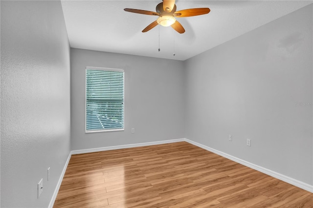 unfurnished room with ceiling fan and light hardwood / wood-style floors