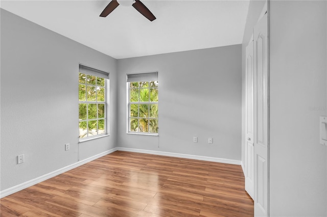 unfurnished room featuring ceiling fan and wood-type flooring