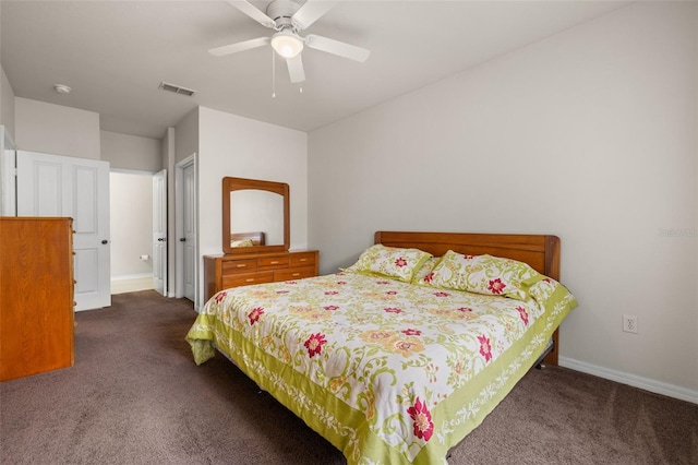 bedroom with dark carpet and ceiling fan