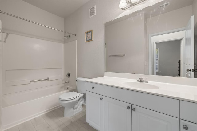 full bathroom with  shower combination, vanity, and toilet