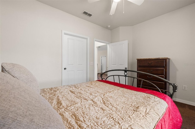 bedroom with a closet, dark colored carpet, and ceiling fan