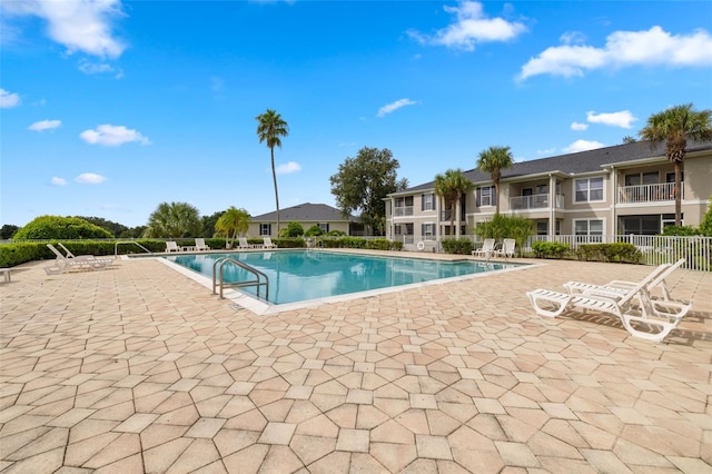 view of swimming pool with a patio area