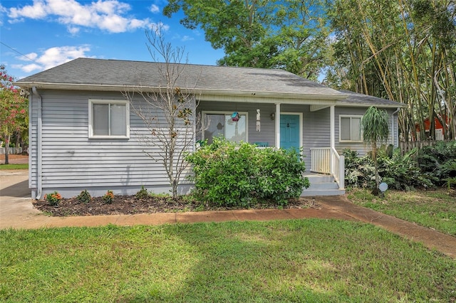 view of front of house with a front lawn and covered porch