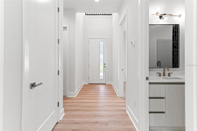 interior space featuring light hardwood / wood-style floors and sink