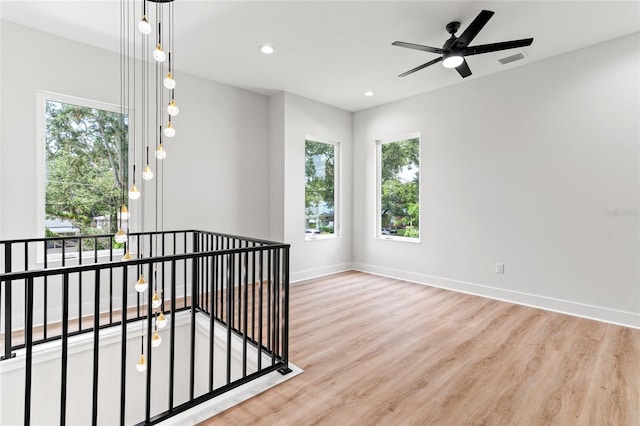 interior space with ceiling fan and light wood-type flooring