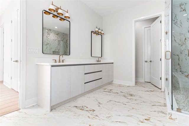 bathroom with vanity and a shower with shower door