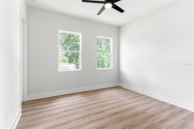 unfurnished room featuring ceiling fan and light hardwood / wood-style flooring