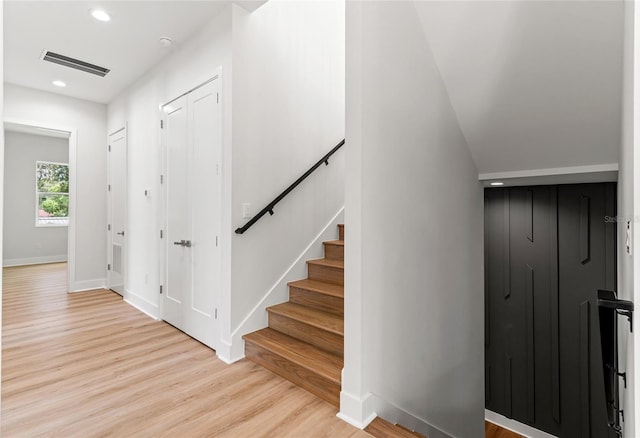 stairs with wood-type flooring