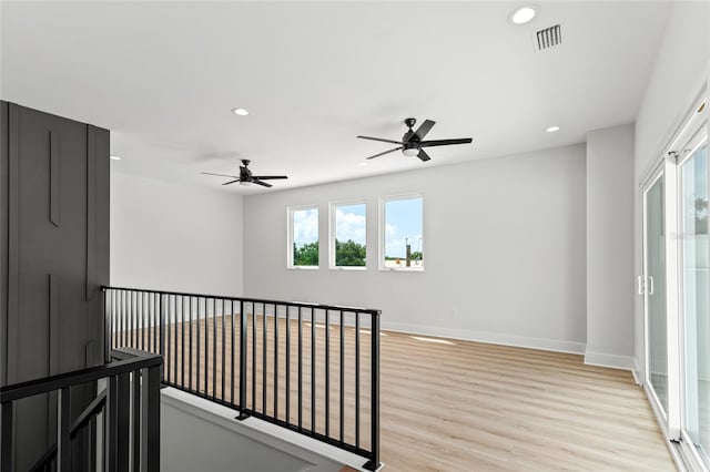 hallway featuring light hardwood / wood-style flooring