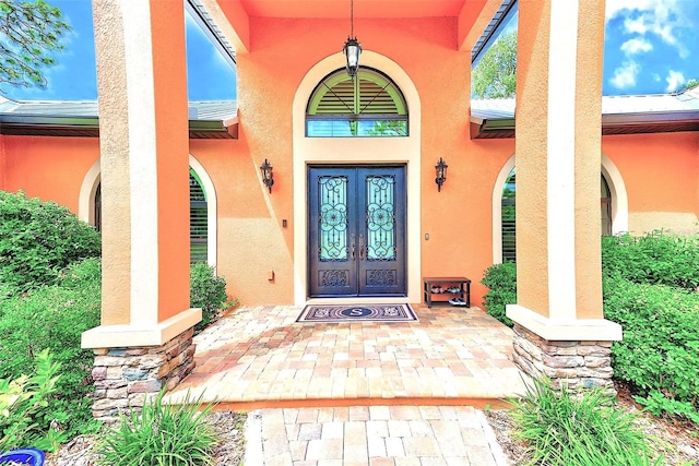 entrance to property featuring french doors