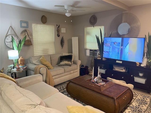 living room featuring ceiling fan and beam ceiling