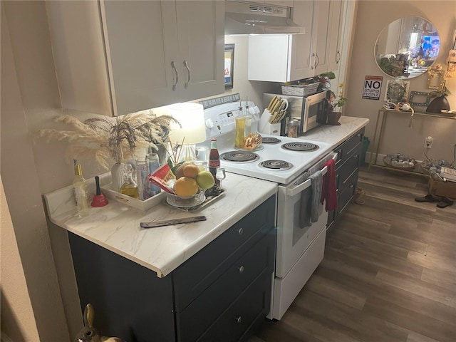 1874 Douglas Ave, Clearwater, FL 33755 - kitchen featuring light countertops, dark wood-type flooring, under cabinet range hood, electric range, and white cabinets